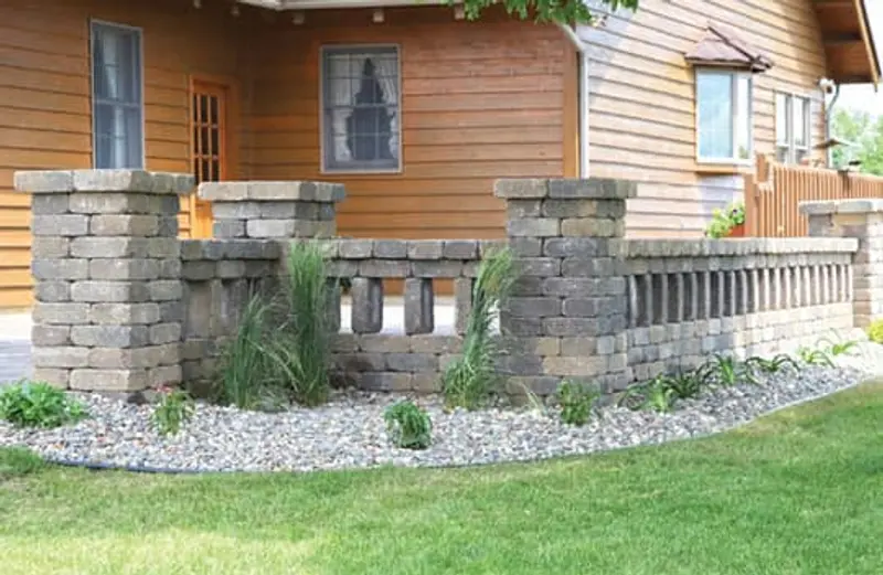 A home with a wrap around garden of fresh plants and stone courtesy of The Axe Man.